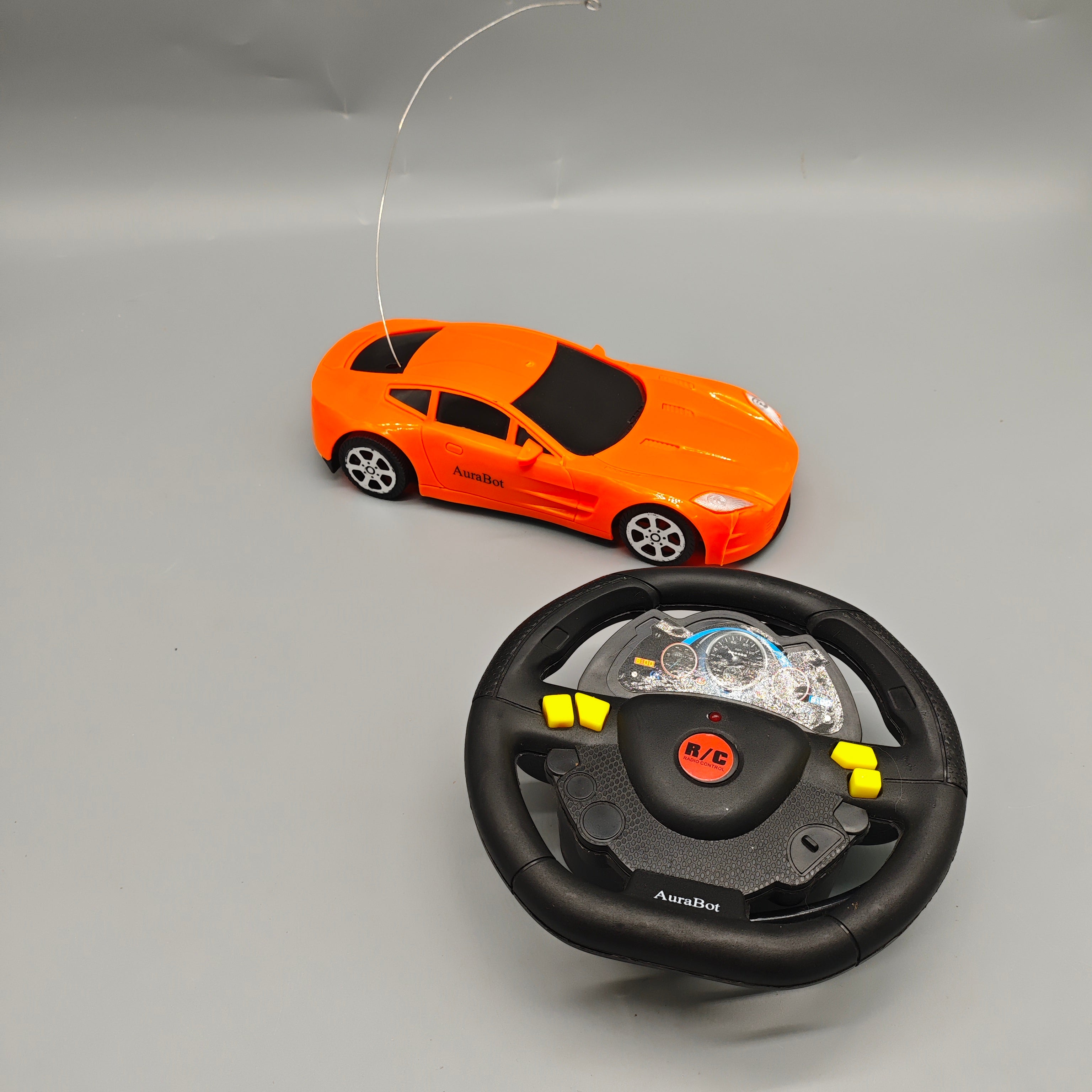 AuraBot Remote-Controlled Toy Vehicles, 180×70×40mm Orange Sports Car with Steering Wheel Controller, Realistic RC Racing Car for Kids