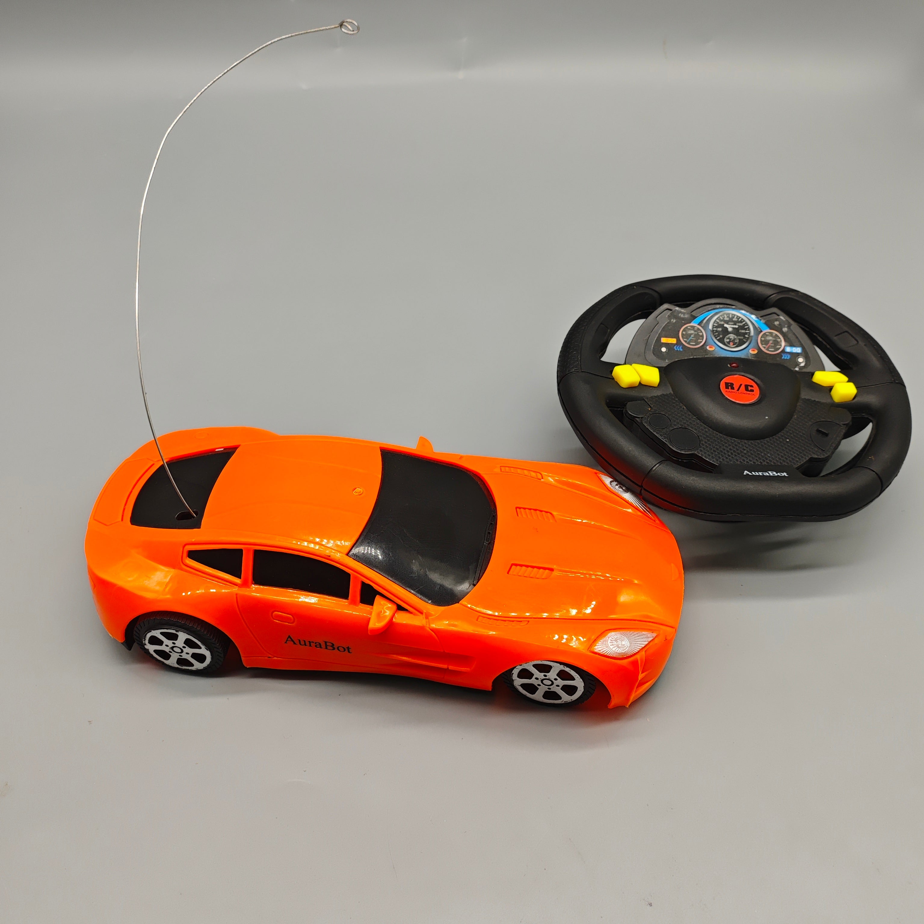 AuraBot Remote-Controlled Toy Vehicles, 180×70×40mm Orange Sports Car with Steering Wheel Controller, Realistic RC Racing Car for Kids
