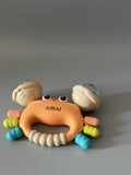 AIBAI Infant Toy – Grasp & Teething Training Toy, Gentle Sound, Safe Soft Rubber + ABS, 12.7×4.6×9.6cm