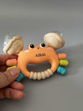 AIBAI Infant Toy – Grasp & Teething Training Toy, Gentle Sound, Safe Soft Rubber + ABS, 12.7×4.6×9.6cm